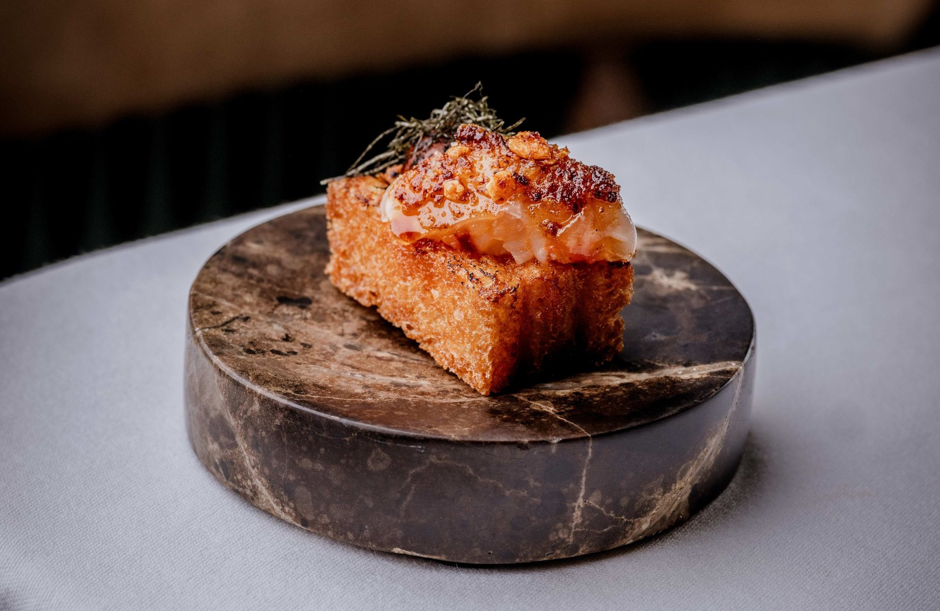 One of Tom Brown's seafood snacks from his latest MICHELIN-Starred venture. © Lateef Okunnu/Tom Brown at The Capital
