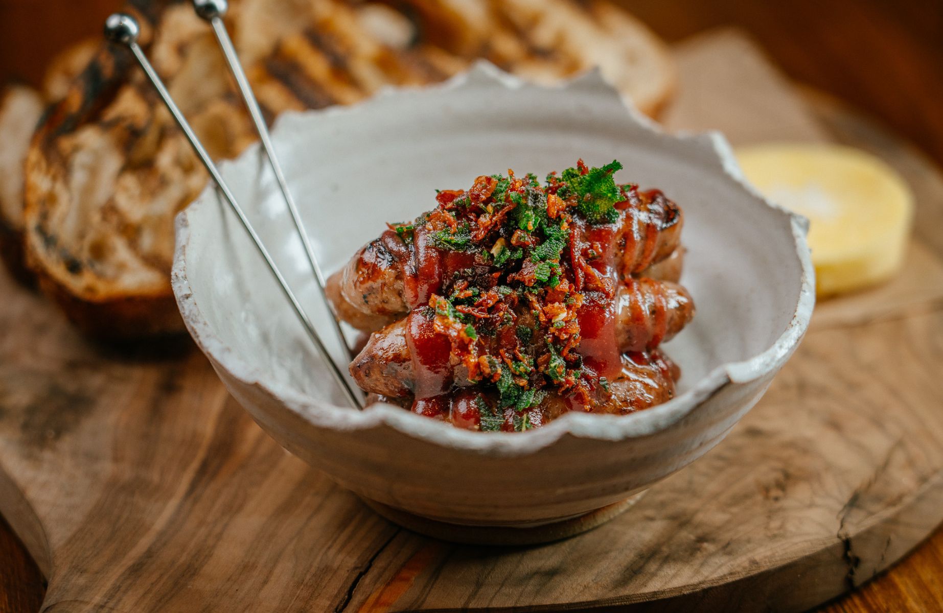 Eight at Gazegill by Doug Crampton's homemade sausages using herbs from their Care Farm project. © Pavel Szylobryt/Eight at Gazegill by Doug Crampton