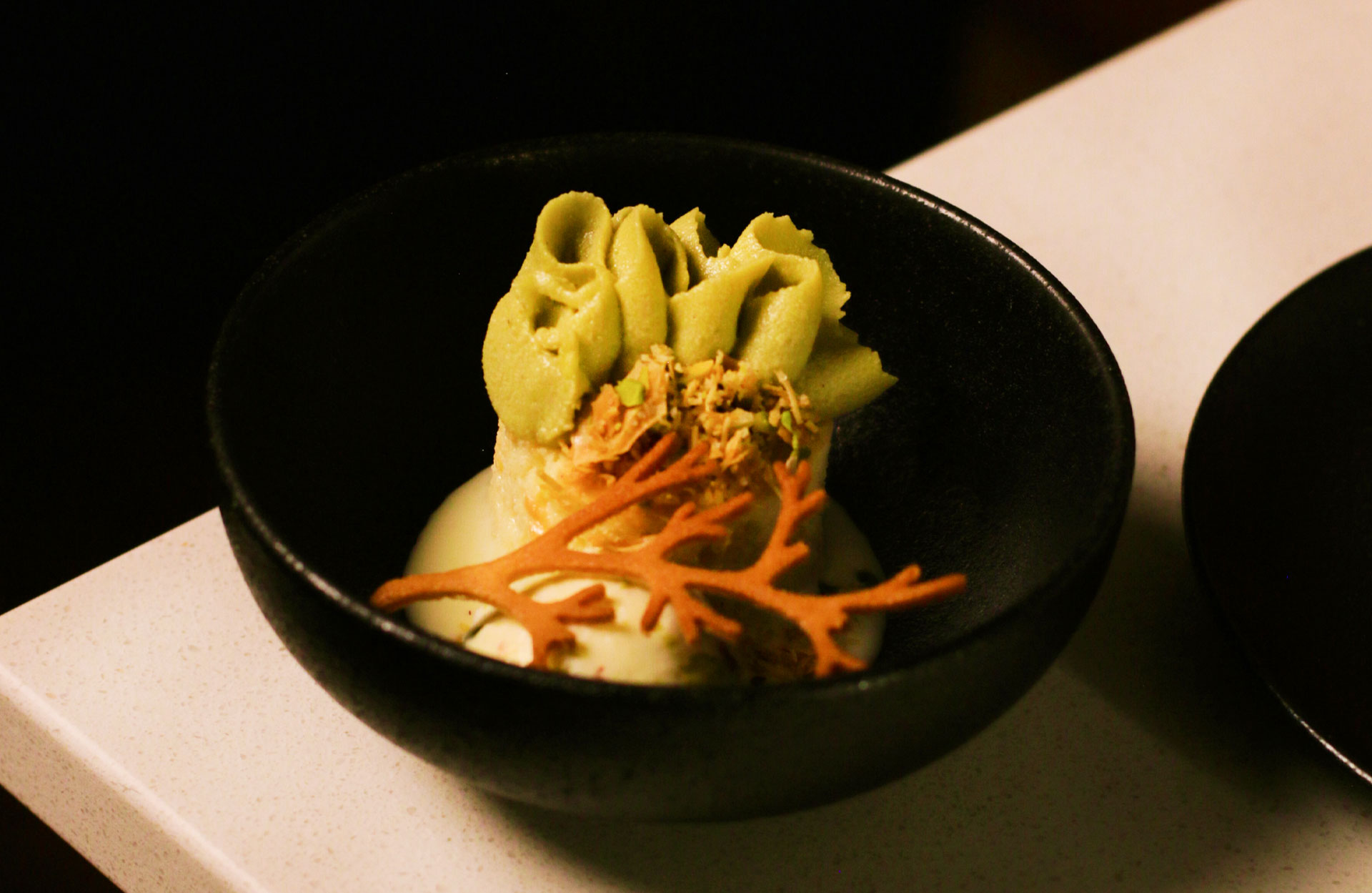 Milk cake with pistachio and booza closes out the meal. © Royce Visuals