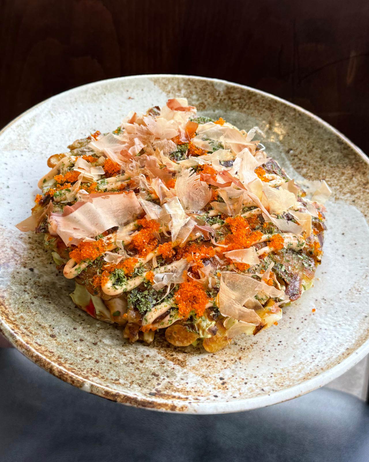 Okonomiyaki has a crispy exterior and a fluffy interior. © Sho Kamio/Lyasare