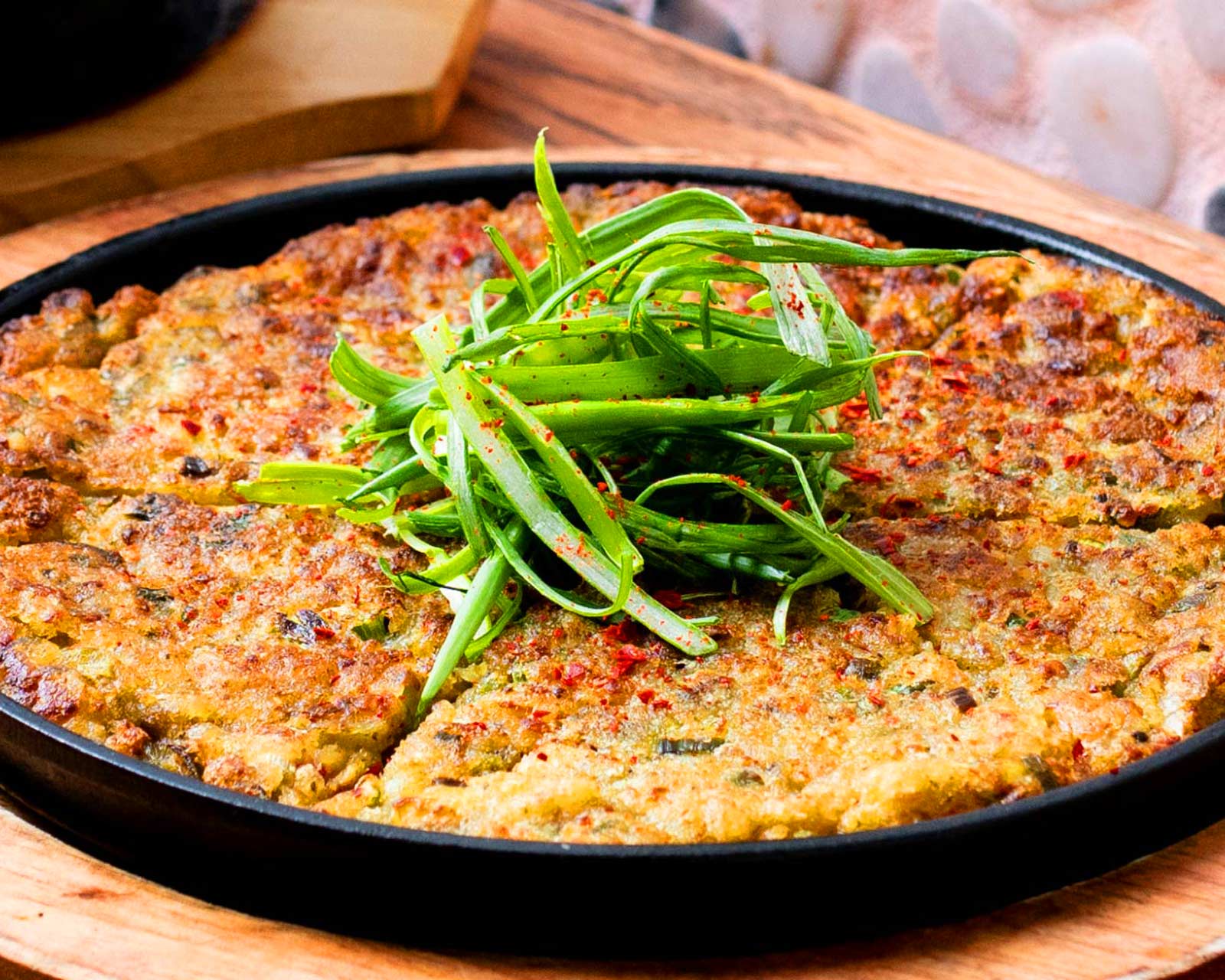 Korean pajeon is a savory scallion pancake. © NOM Digital/Mandu