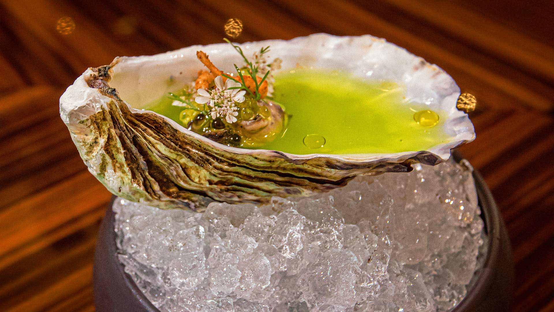 Oyster with delicate flowers. © Grand Velas Los Cabos/Cocina de Autor Los Cabos