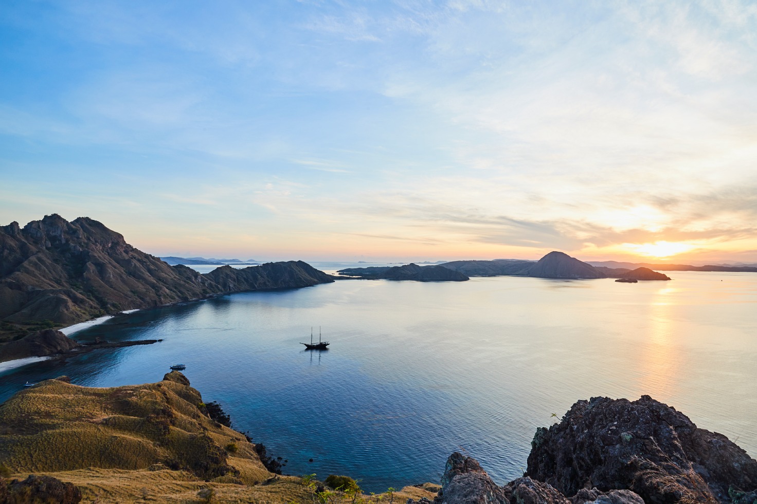 Aboard the handcrafted Aman XIV outrigger, dive and snorkel through the pristine waters surrounding Moyo Island. © Amanwana
