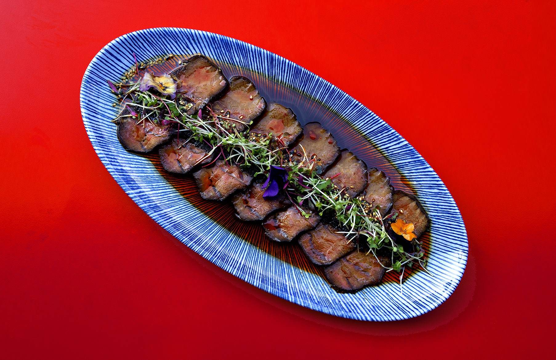 A BIGFAN dish set against a suitably vibrant red background for such a fun, lively restaurant. © Robert Hayes/BIGFAN
