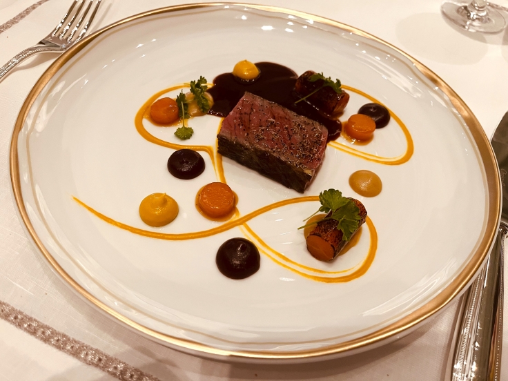 An artistically plated Wagyu dish from Julien by Daniel Boulud. © Michelin