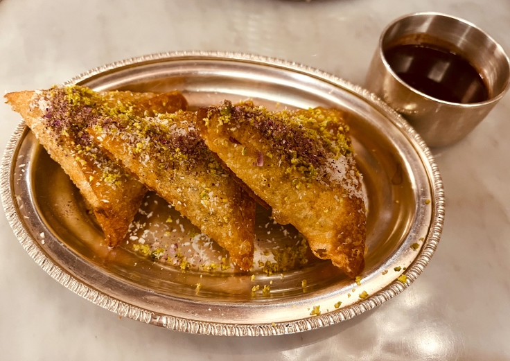A beloved Persian street food, this is a triangle-shaped, meat-filled pastry known as sambuseh. © Michelin