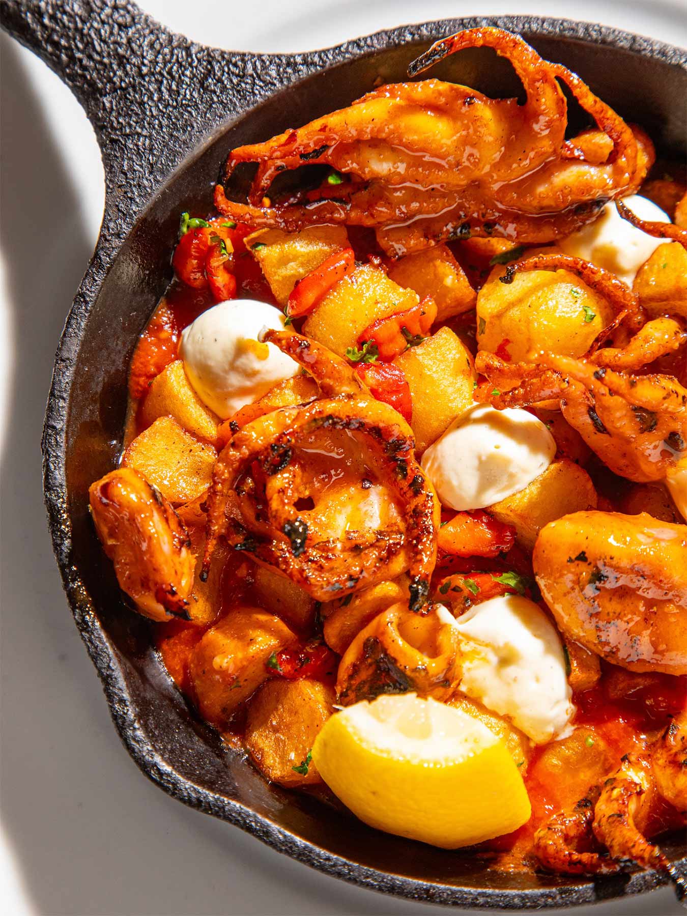 Seafood, like grilled baby octopus with crispy fingerling potatoes, garlic aioli and salsa brava, figures largely on Zasu's menu. © Kat Kimball/Zasu