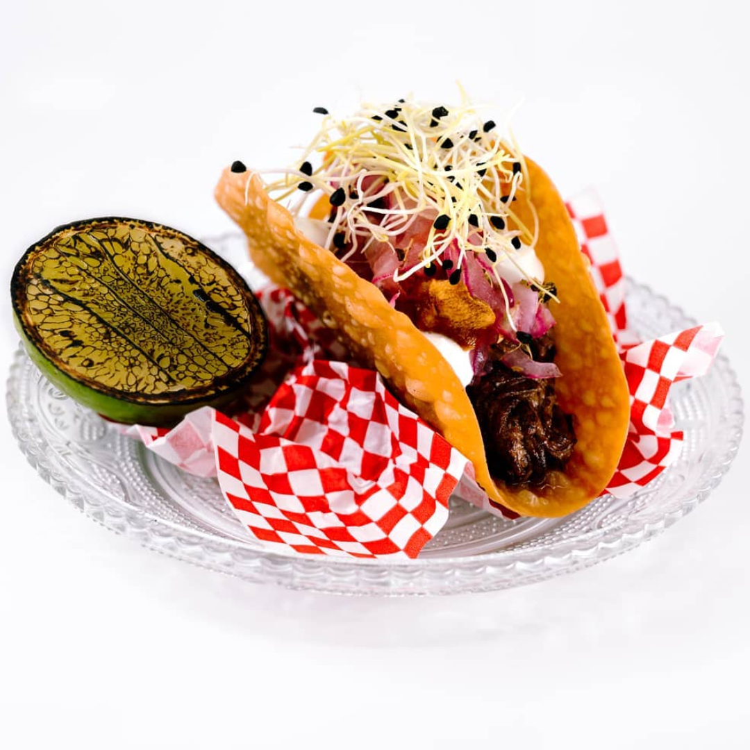 A creative twist on tradition with the Greek Taco. © Cerdo Negro 1985