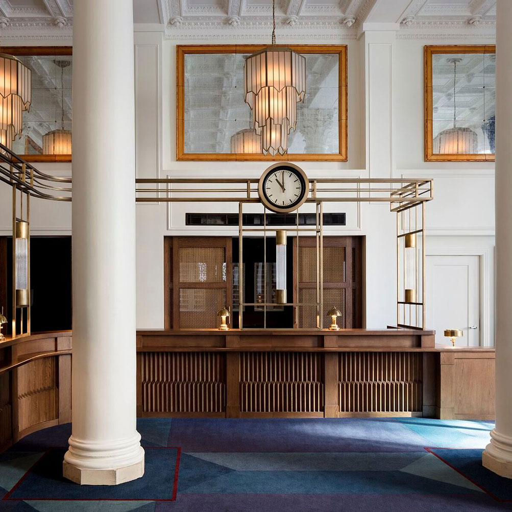 Jewel-tone design touches remake the Romanesque Revival bank building that the Riggs calls home. © Riggs