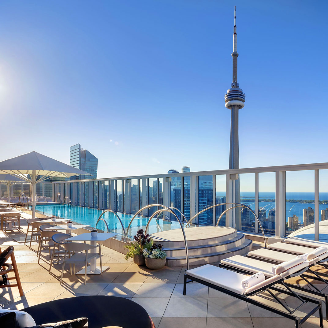 A stylish rooftop features a 7,000‑square‑foot terrace with an outdoor infinity pool. © Bisha Hotel