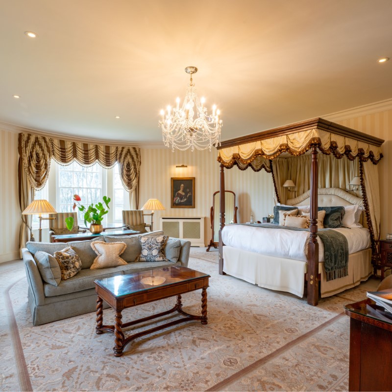 A typically luxurious room with four-poster bed at the Three-MICHELIN-Key Lucknam Park. © Lucknam Park, Emblems Collection