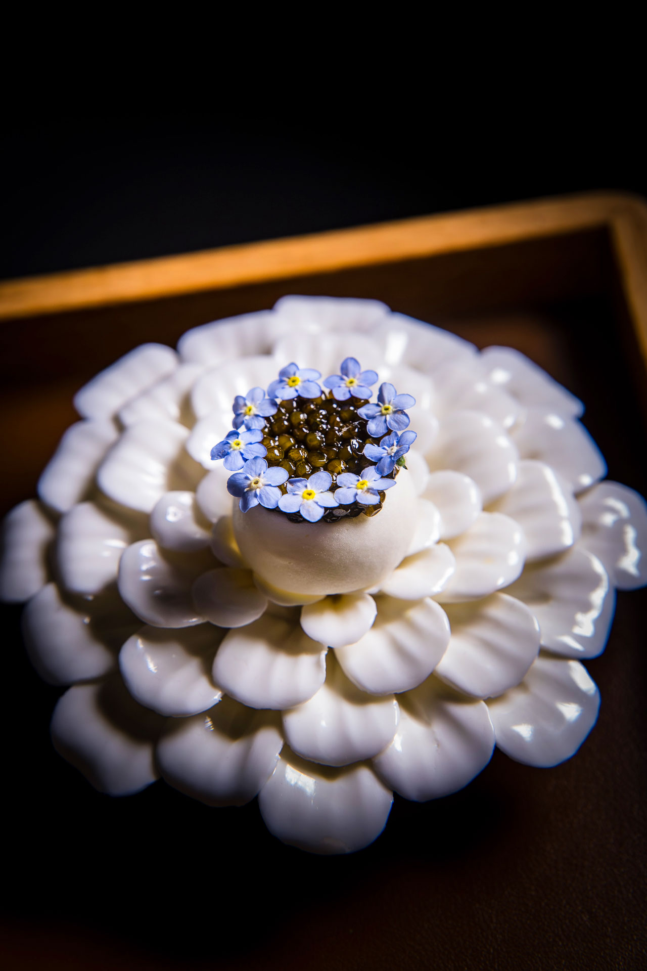 "A Fleeting Taste of the Sea" - Dashi meringue, smoked crème fraîche, egg yolk, Kristal caviar. © John Troxell