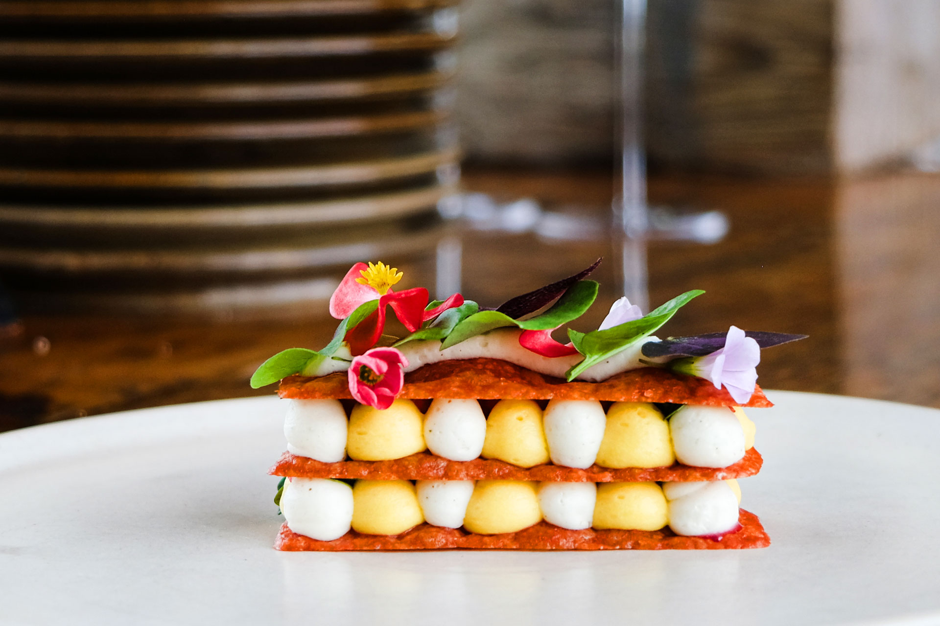 Mille Feuille with Mille Feuille - Beet Tuile, False Cardamom Chantilly, Peach Curd, Wild Strawberries, Oxalis, Oxalis Flowers, Begonias, Spade Sorrel, Red Sorrel Flowers © Alex Creglia