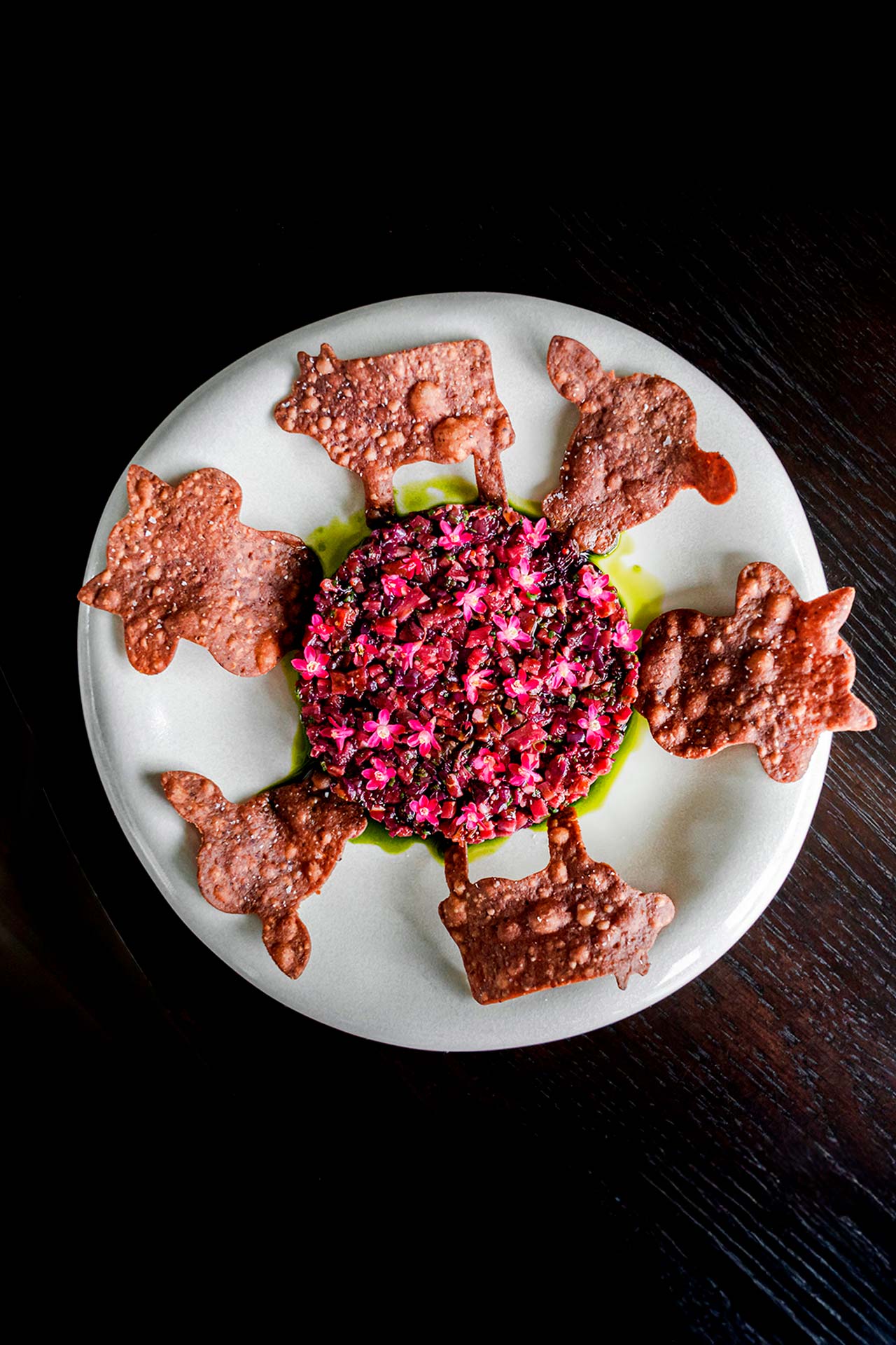 Wagyu beef tartare is given a visual boost with malted barley tostadas, flowering currants and black currant leaf. © Published on Main