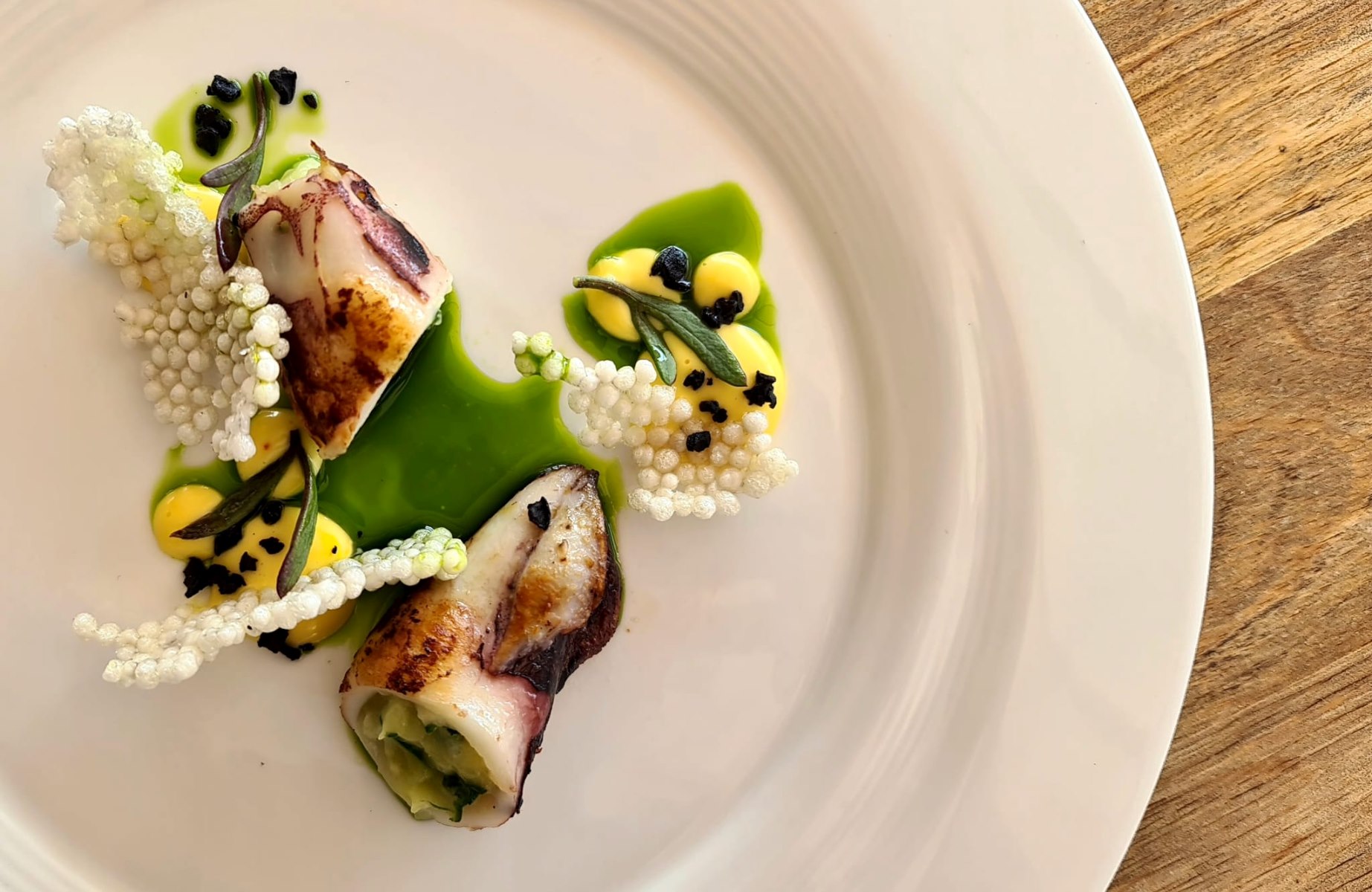 Stuffed calamari with garden vegetables. © Bugenvila