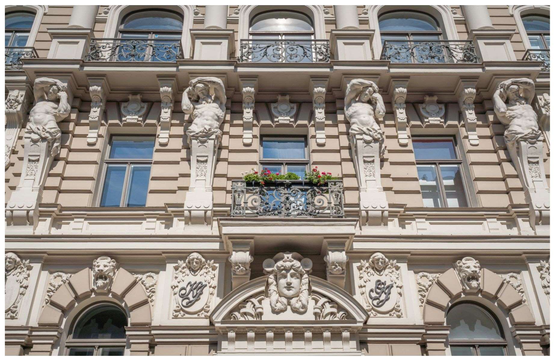 Ornate detailing on one of Riga's stunning art nouveau buildings. © diegograndi/iStock