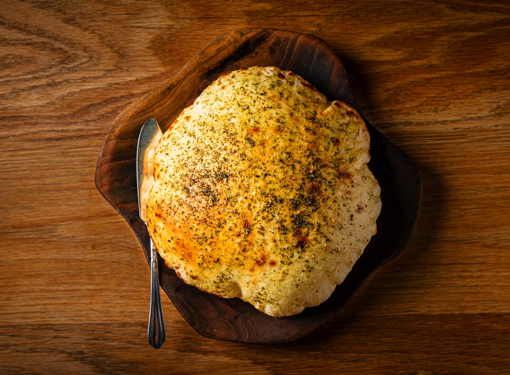The puffy pita at Albi bears to be torn into for nibbling. © Rey Lopez/Albi