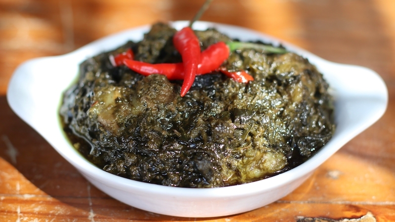 Ginataan refers to the Filipino technique of simmering ingredients in coconut milk — seen here in laing, where taro leaves and meat are slowly cooked into a rich, spicy and deeply aromatic stew. © Dorothy Puray-Isidro