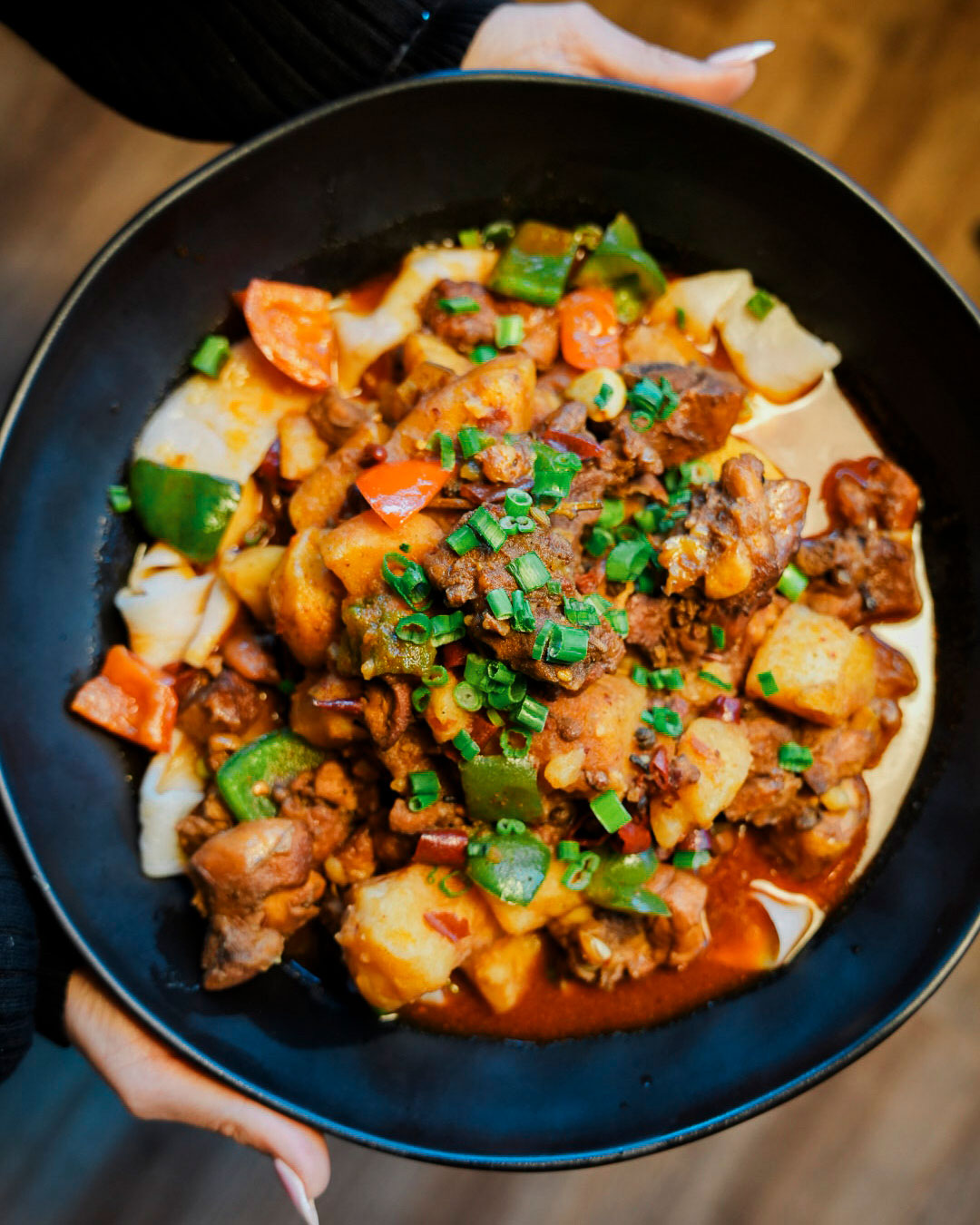 Jahunger's bone-in chicken stew is laced with Yanji chiles. © Jahunger