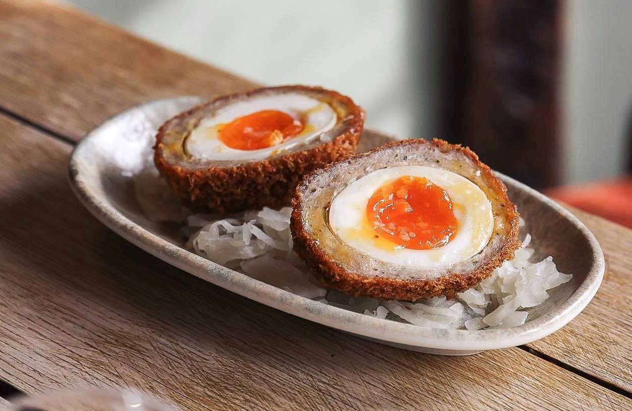 Warm Scotch Egg with Sauerkraut at The Peacock Inn, Chelsworth. © The Peacock Inn