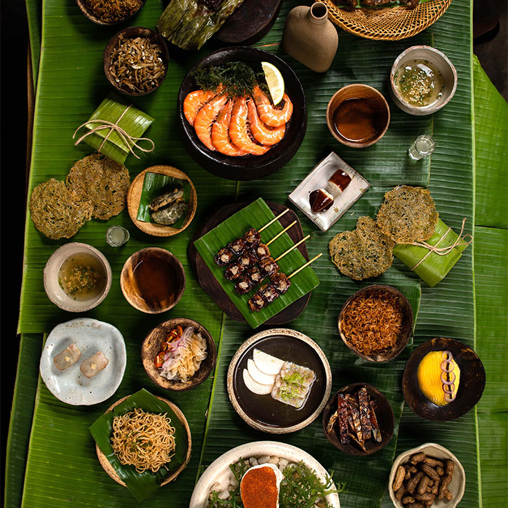 Pour vivre une expérience traditionnelle, essayez le kamayan : un repas à partager servi sur une feuille de bananier, que l'on mange avec les mains. ©Geric Cruz/Toyo Eatery