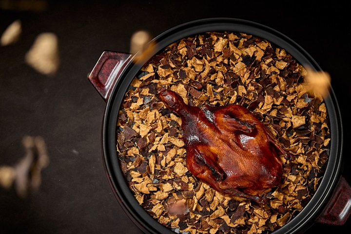 Roasted squab infused with aged tangerine peel from One-MICHELIN-Starred China Tang. © China Tang
