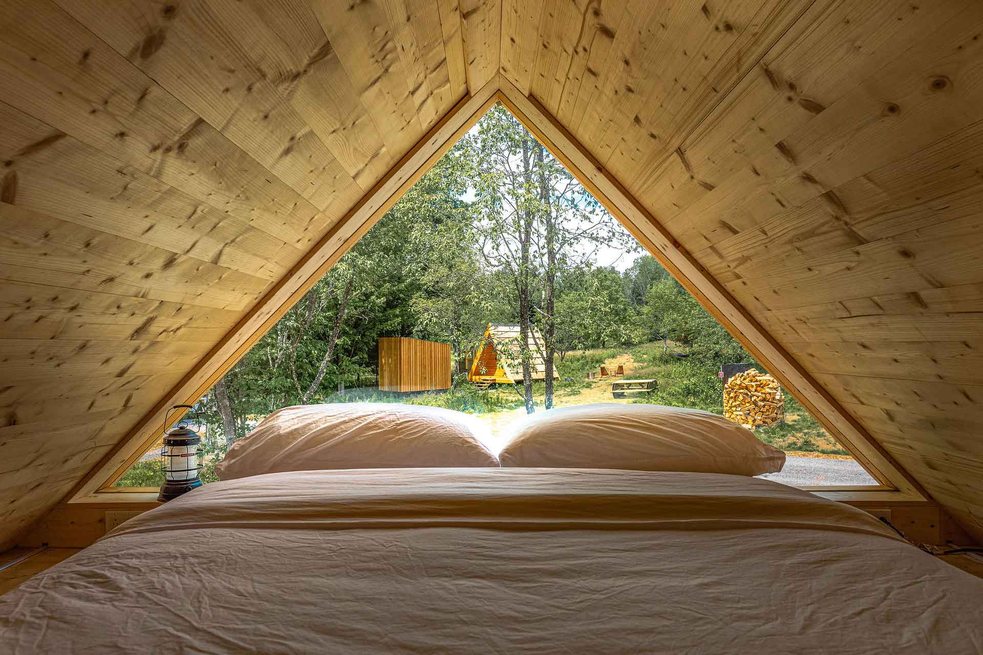 A view from within a distinctive A-frame-style accommodation at Eastwind. © Lawrence Braun, Eastwind Hotel & Bar