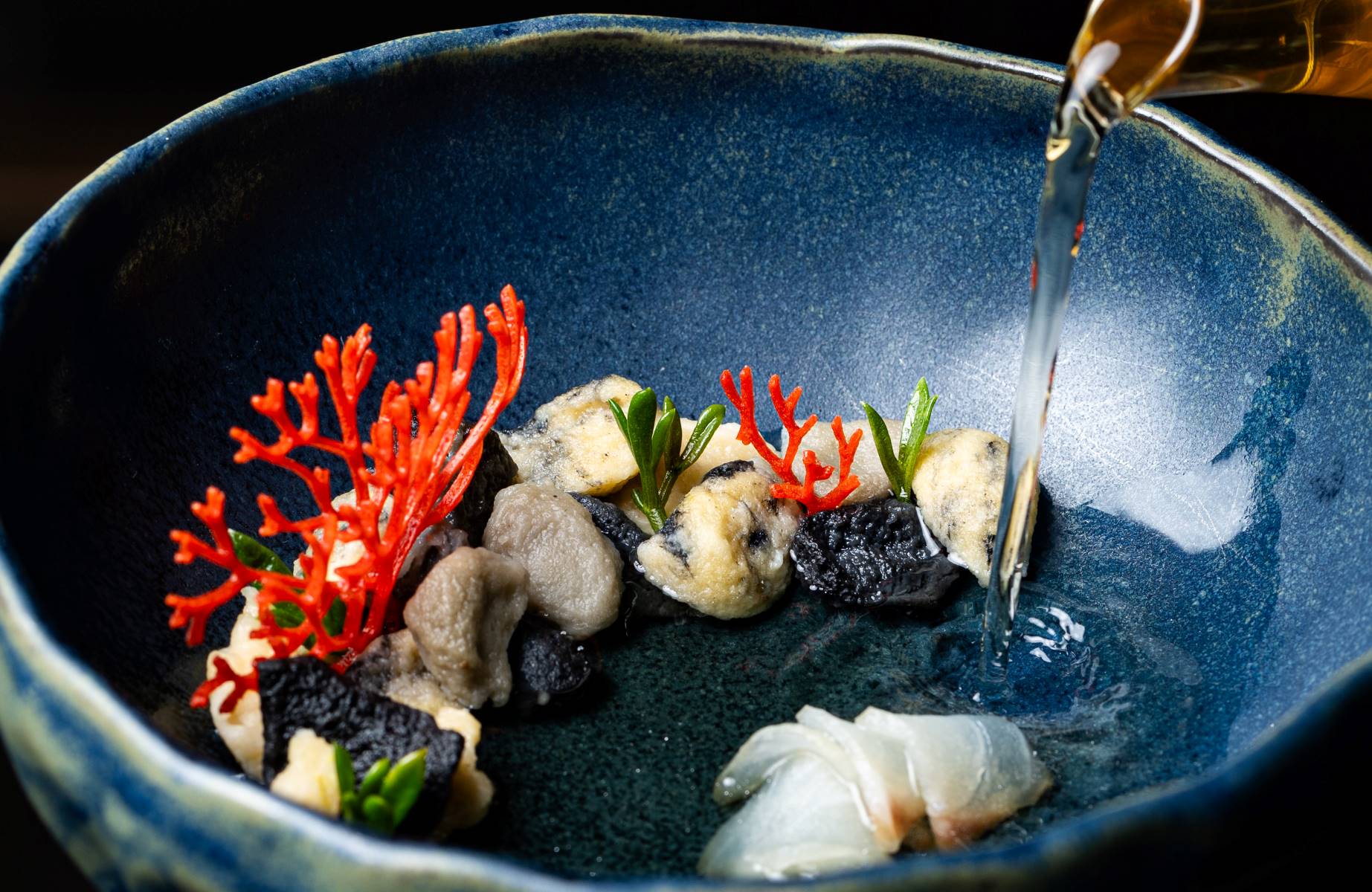 Clarified fish soup, sea bass, cuttlefish ink, scallop roe, Timut pepper, marjoram. © Matija Djanješić/Nebo