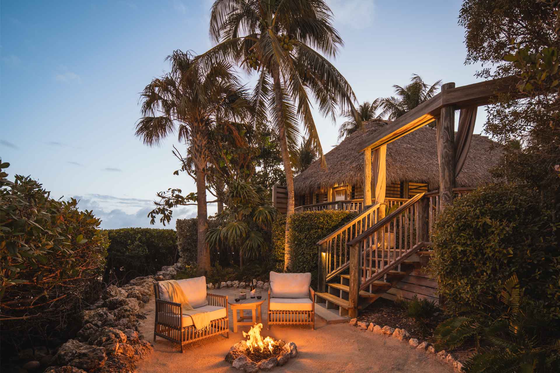 A private outdoor space for romance and conversation around the fire. © Little Palm Island