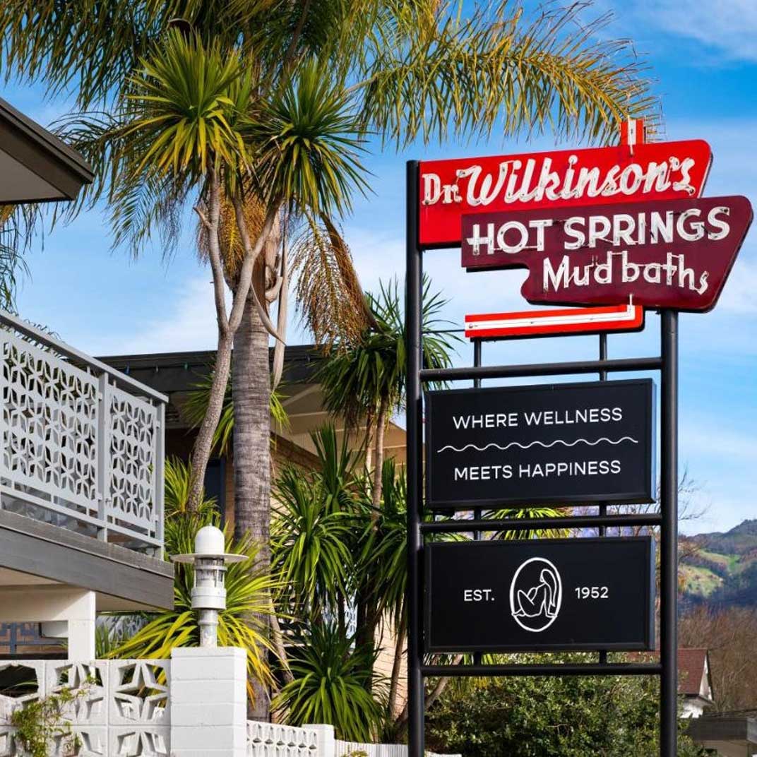An original retro sign shows off Dr. Wilkinson’s quirky vibe in highly curated Napa Valley. © Dr. Wilkinson's Backyard Resort & Mineral Springs