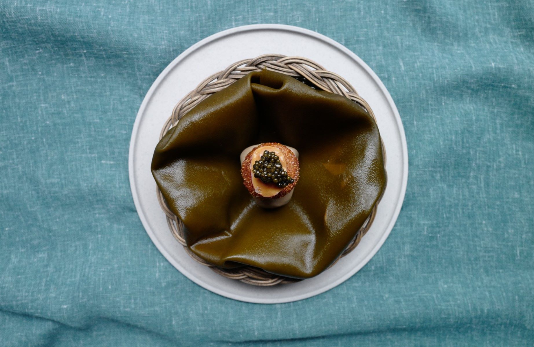 A beautifully presented snack from Grön, now holding Two MICHELIN Stars. © Toni Kostian/Grön