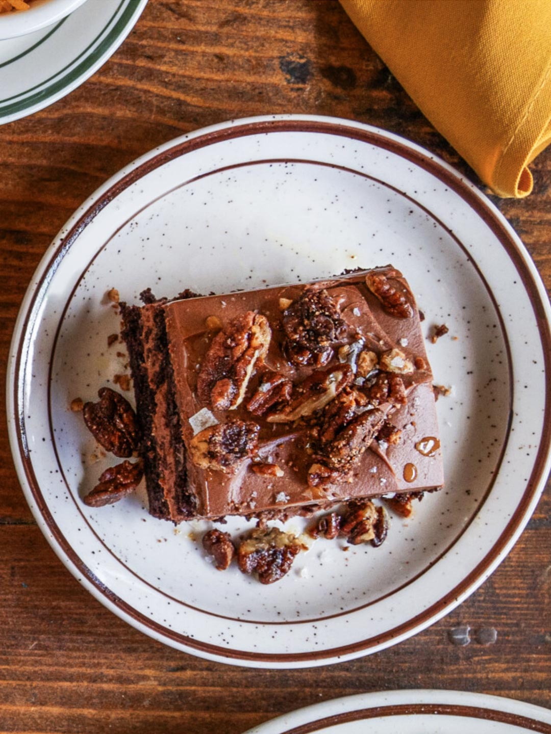 Chocolate layer cake with candied pecans. © Yellow Rose