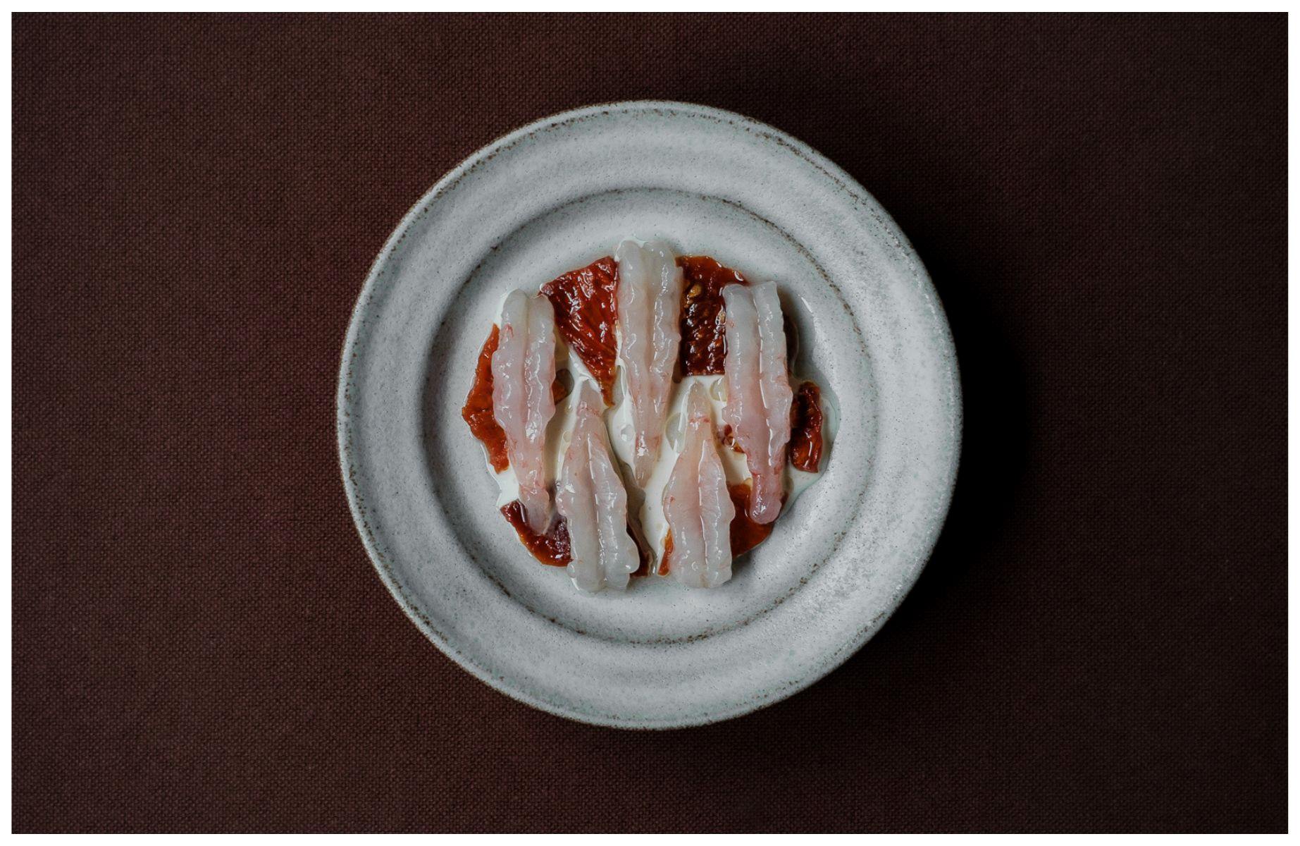 The purity of raw Norwegian shrimps combined with the intensity of preserved tomatoes. © Soren Kristian Reed/Kadeau Copenhagen