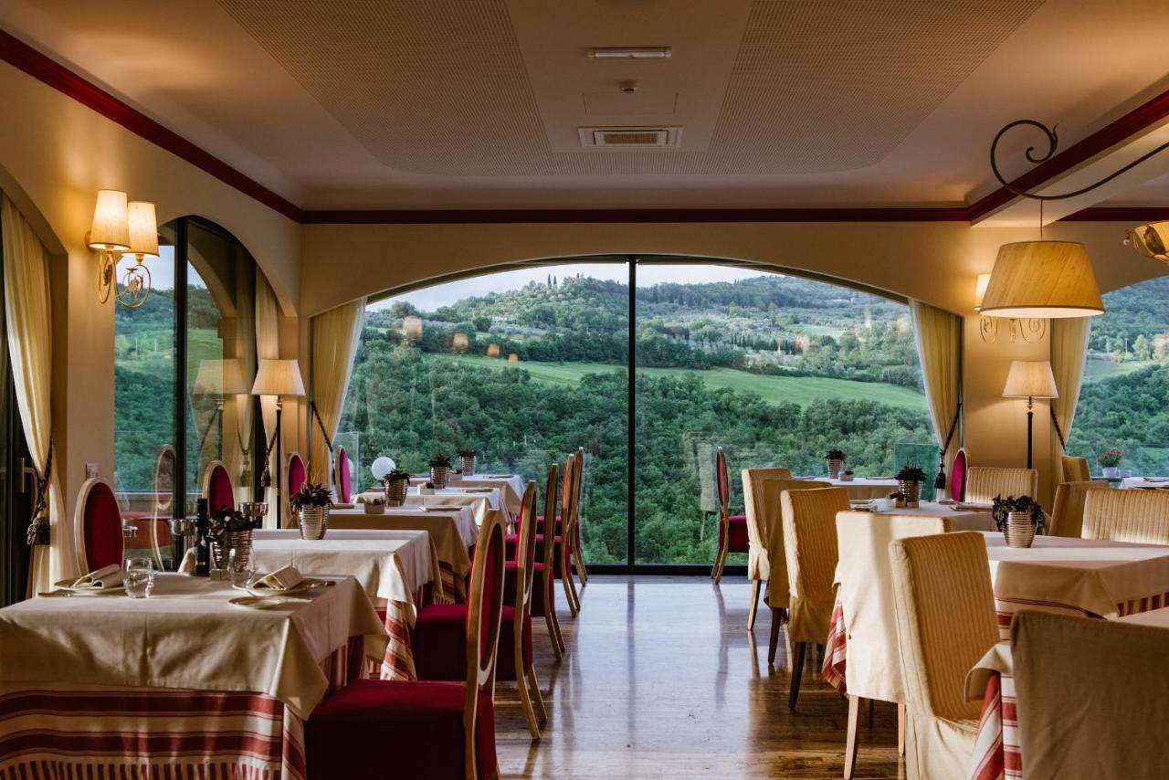 The view of the Tuscan hills from La Rocca, the restaurant at MICHELIN-Selected Hotel La Posta in Val d’Orcia. © Hotel La Posta