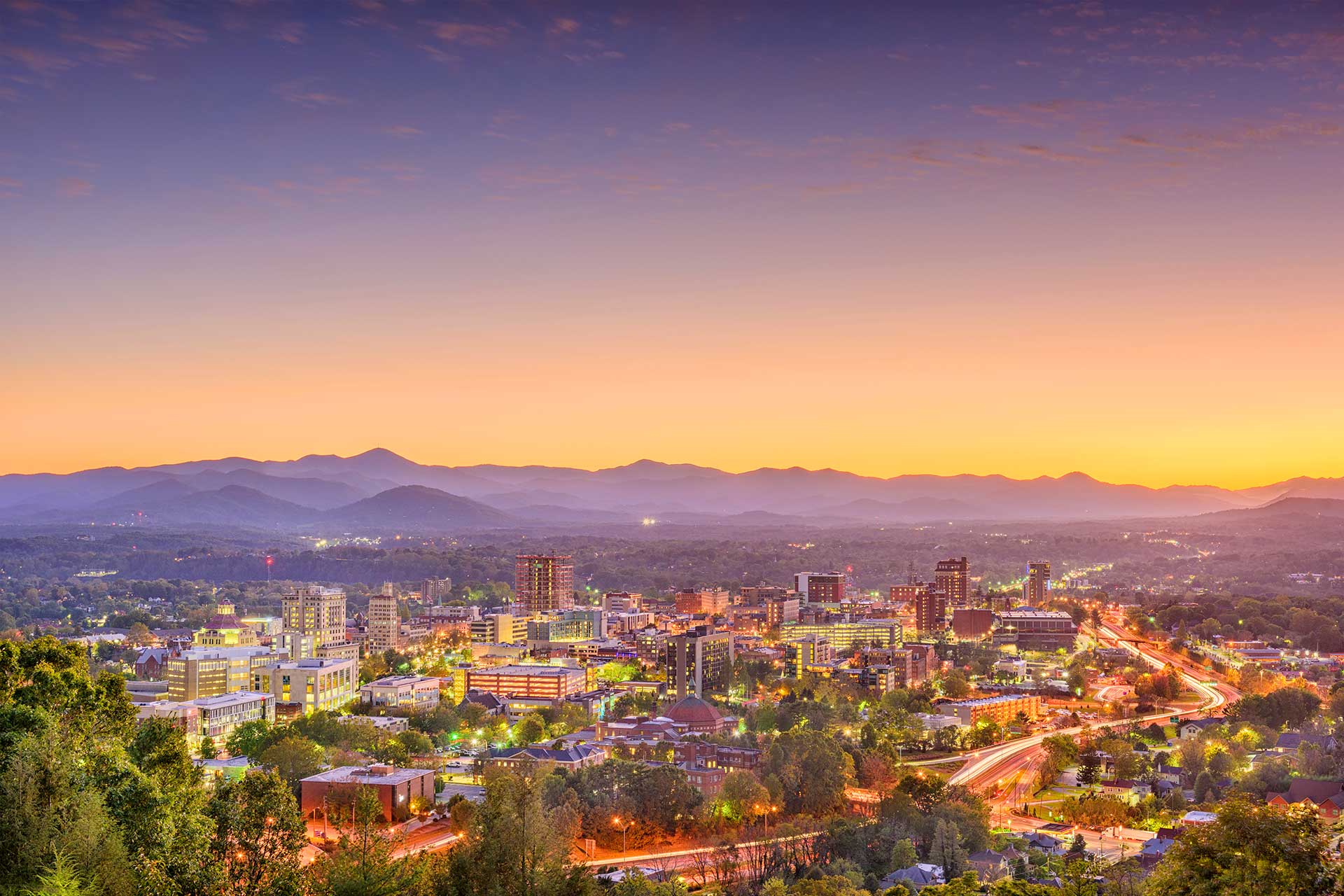 Asheville's skyline set against the Blue Ridge Mountains. © Sean Pavone Photo/Adobe Stock