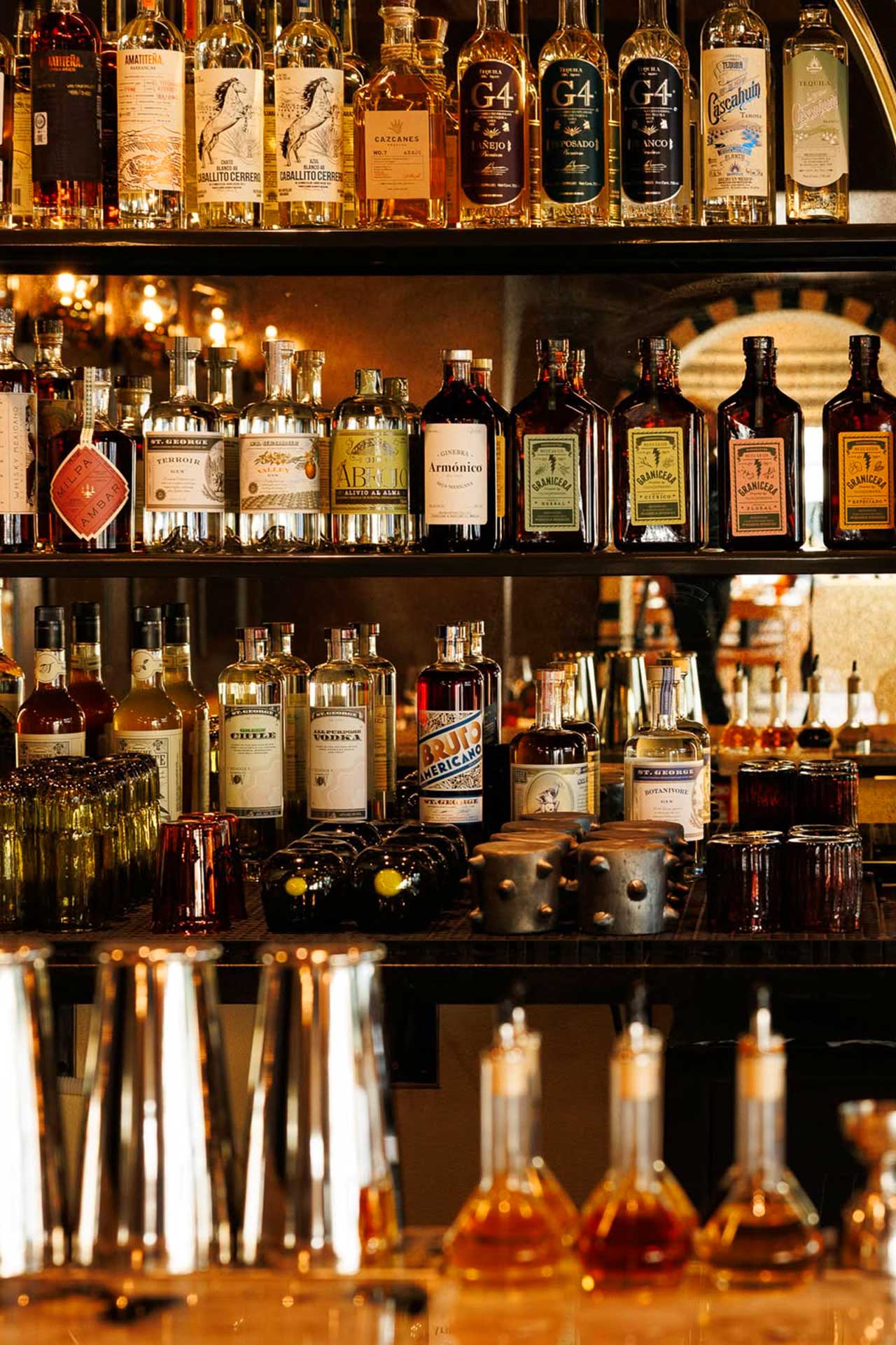 The different spirits that Evan uses to create his signature cocktails. © Maria Isabel