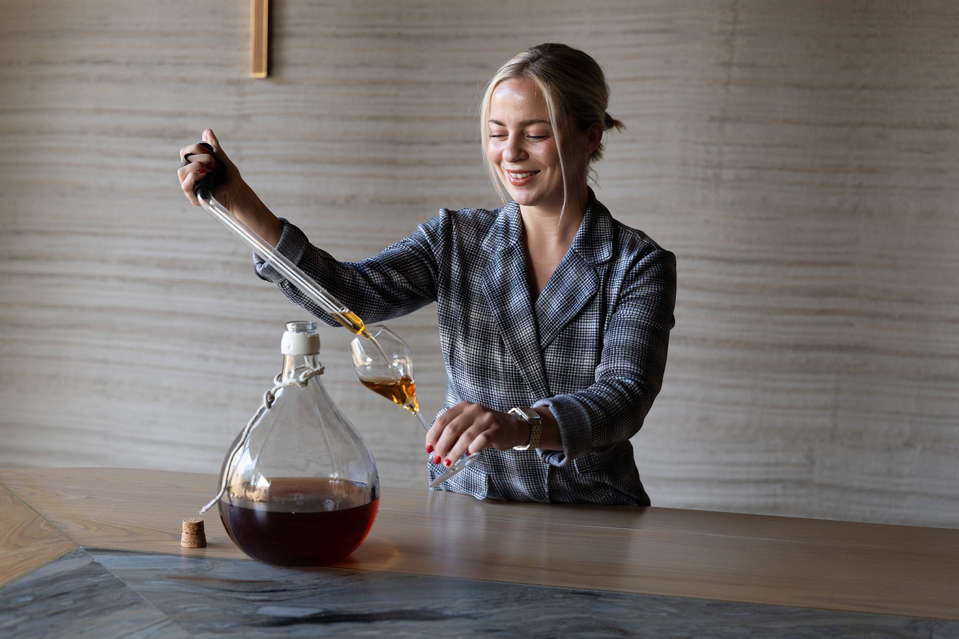 Savannah Riedler gets the Ratafia ready to pair with dessert. © Lilo