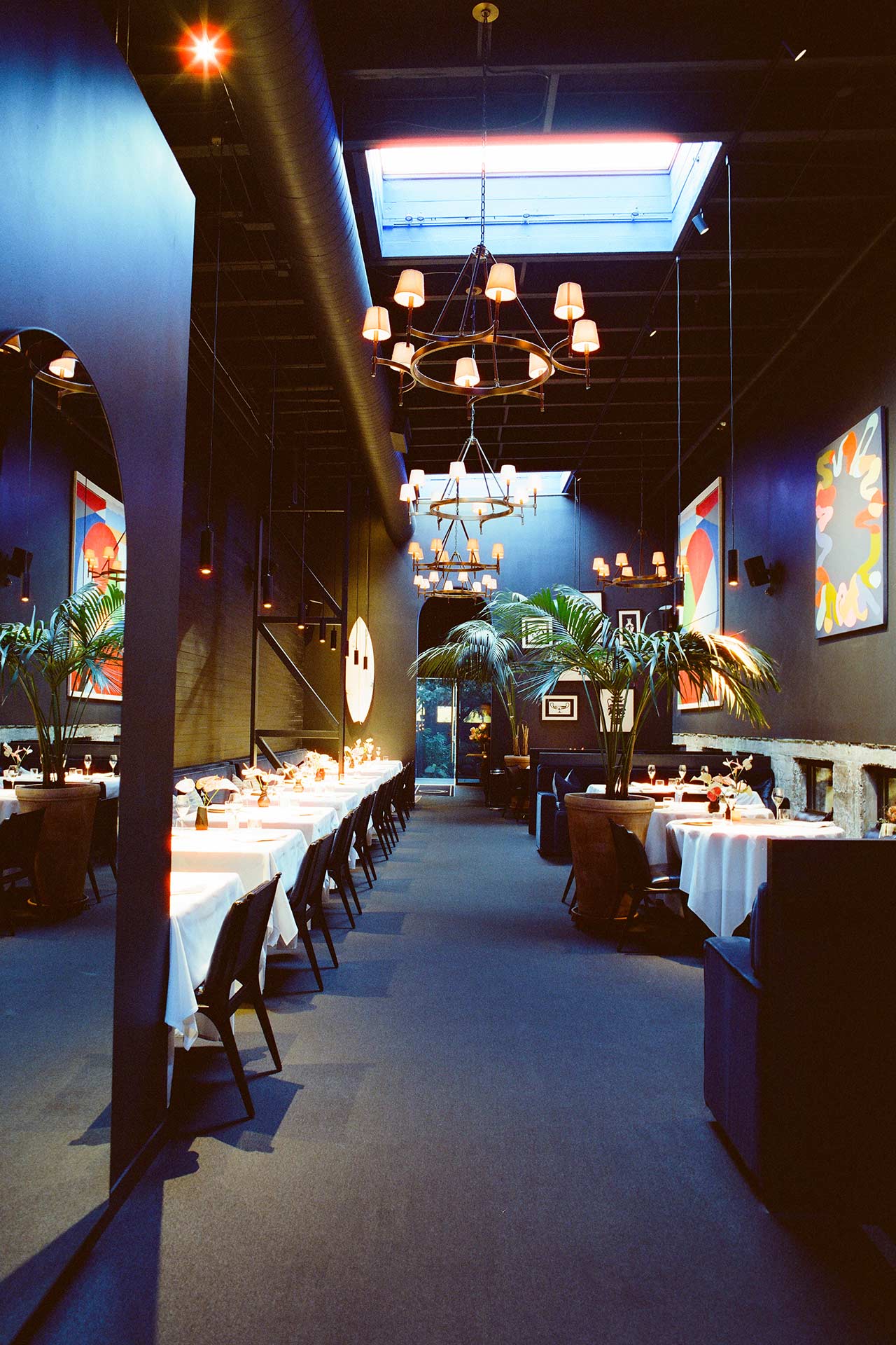 The dining room enhanced with vibrant art. © Val Cantú/Californios