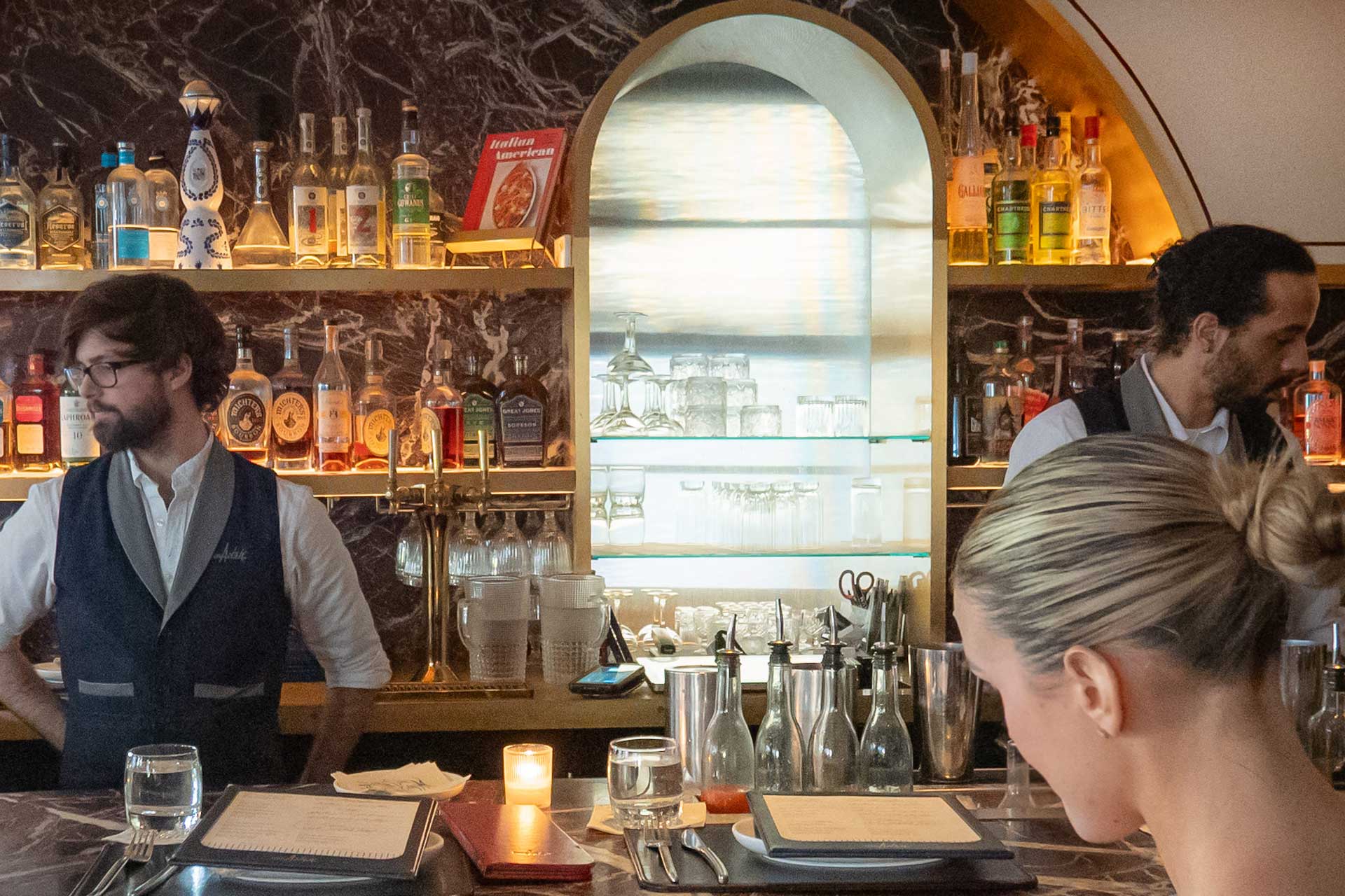 Tables are often difficult to get at Don Angie, but a seat at the bar lets you watch skilled bartenders at work making exquisite cocktails. © Thomas Robert Clarke Photography / MICHELIN Guide