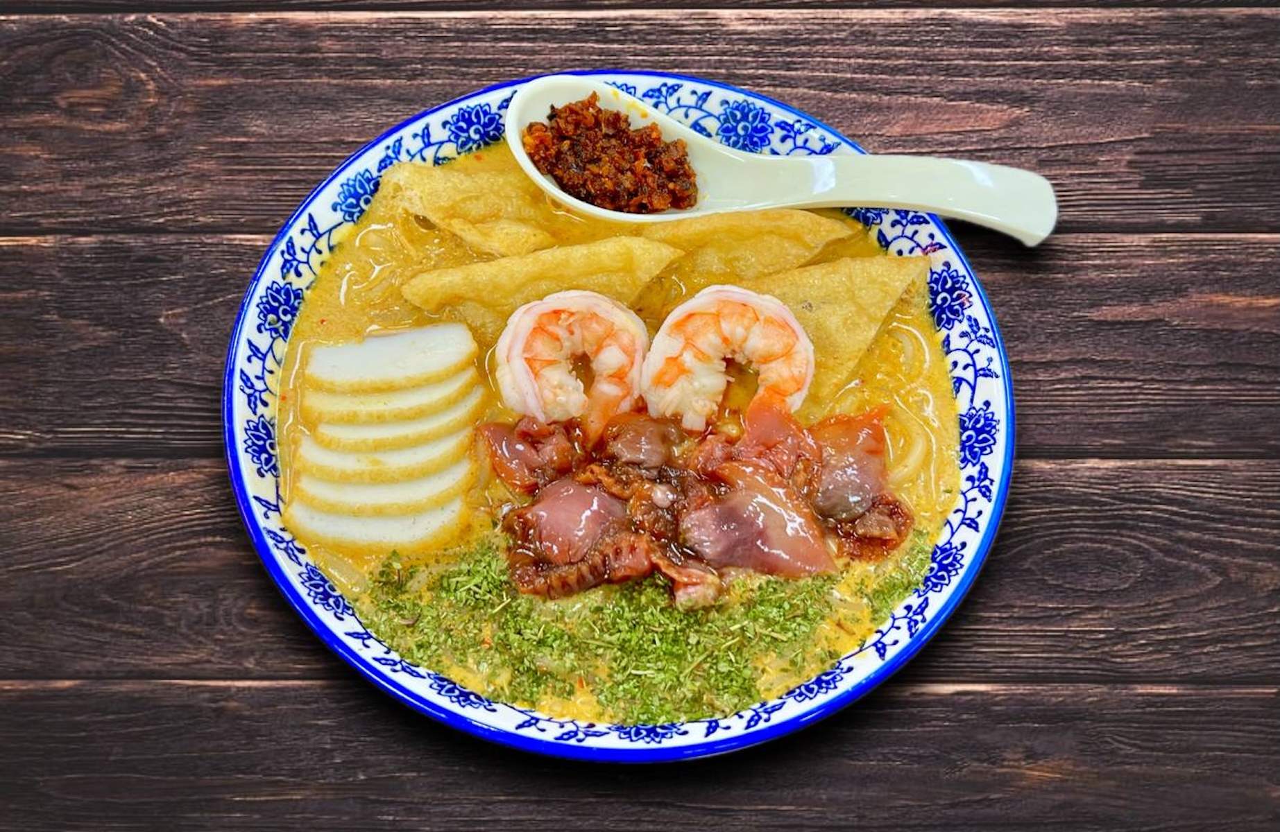 King of Laksa's come packed with seafood. © The MICHELIN Guide